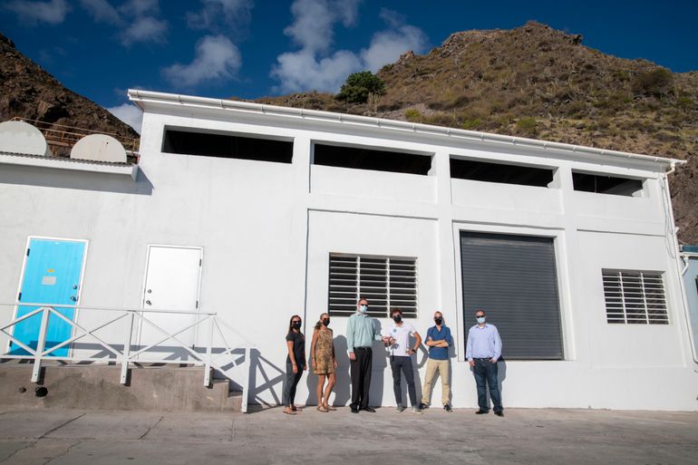 Official key handover. From left to right: Ayumi Kuramae Izioka, Saba Bank Science Coordinator; Lynn Costenaro, Board Member Saba Conservation Foundation; Mark Zagers, Managing Director Saba Electric Company; Peter Johnson, President, Saba Conservation Foundation; Alwin Hylkema, Resident Researcher Van Hall Larenstein University; Bruce Zagers, Commissioner Saba Island Government