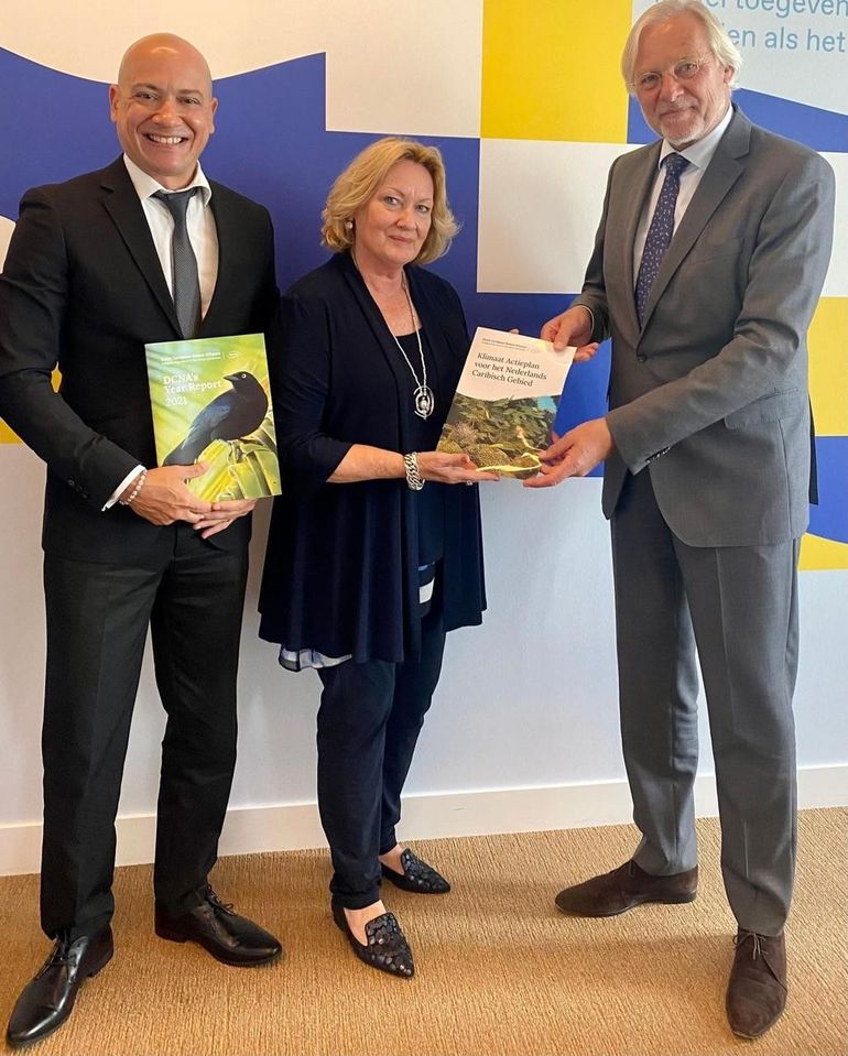 From left to right: DCNA Director Tadzio Bervoets and DCNA Chair Dr. Hellen van der Wal presenting the Dutch Caribbean Climate Plan to the Director General for Kingdom Relations Mr. Henk Brons