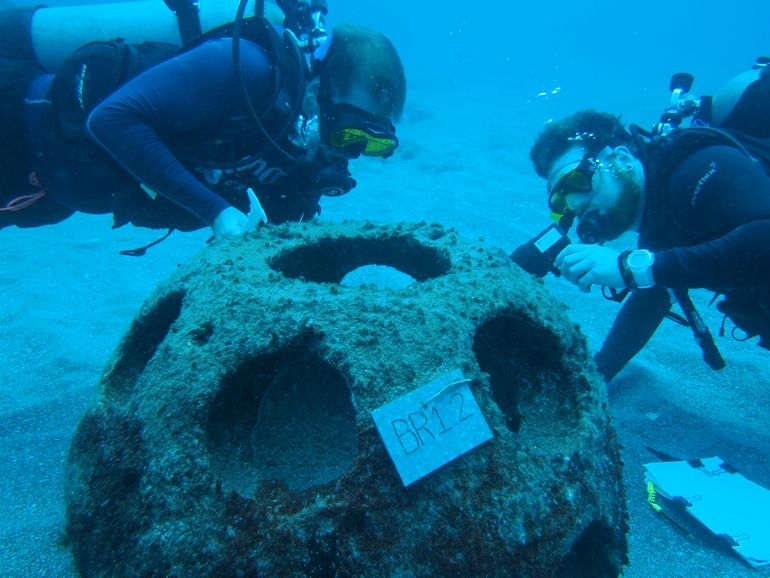 Researchers counting coral recruits on a reef ball