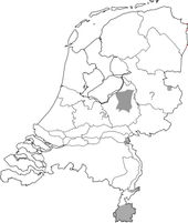 De grijze gebieden geven de verspreiding aan van het vliegend hert in Nederland